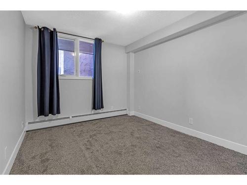 104-716 3 Avenue Nw, Calgary, AB - Indoor Photo Showing Other Room