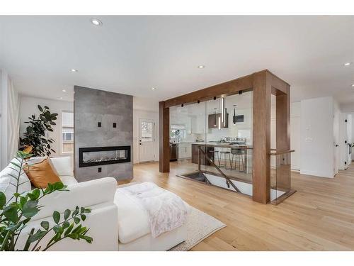 9135 Allison Drive Se, Calgary, AB - Indoor Photo Showing Living Room With Fireplace