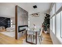 9135 Allison Drive Se, Calgary, AB  - Indoor Photo Showing Dining Room With Fireplace 