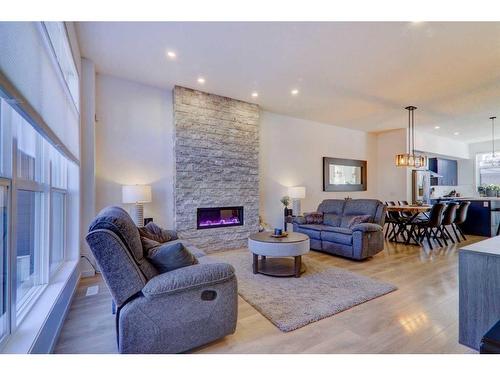 347 Masters Row Se, Calgary, AB - Indoor Photo Showing Living Room With Fireplace