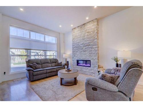 347 Masters Row Se, Calgary, AB - Indoor Photo Showing Living Room With Fireplace