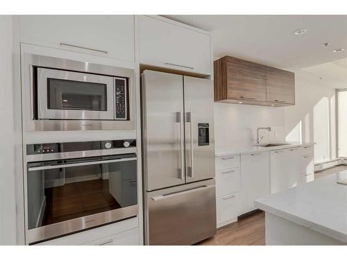 802-1087 2 Avenue Nw, Calgary, AB - Indoor Photo Showing Kitchen With Stainless Steel Kitchen