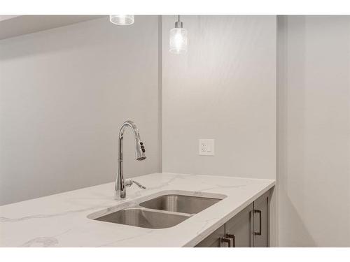 207-19661 40 Street Se, Calgary, AB - Indoor Photo Showing Kitchen With Double Sink