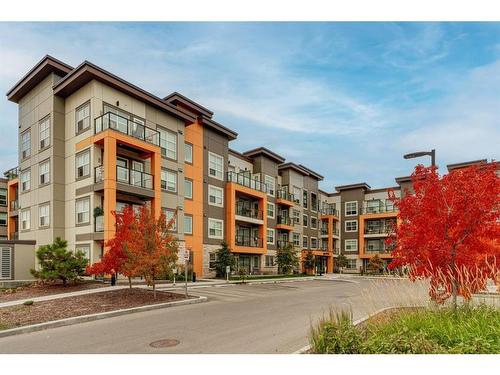 207-19661 40 Street Se, Calgary, AB - Outdoor With Balcony With Facade