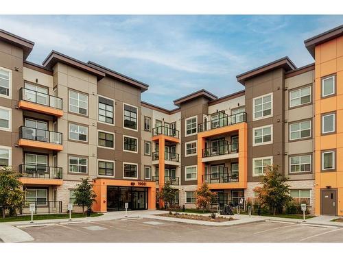 207-19661 40 Street Se, Calgary, AB - Outdoor With Balcony With Facade