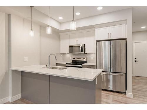 207-19661 40 Street Se, Calgary, AB - Indoor Photo Showing Kitchen With Upgraded Kitchen