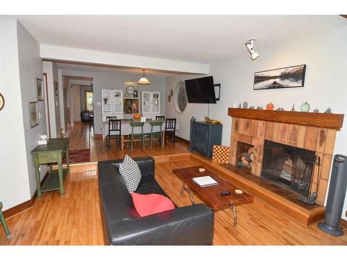 2535 7 Avenue Nw, Calgary, AB - Indoor Photo Showing Living Room With Fireplace