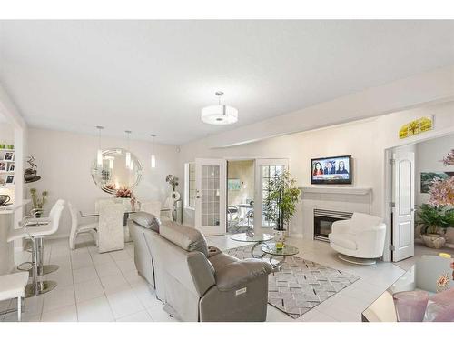 303 Patterson View Sw, Calgary, AB - Indoor Photo Showing Living Room With Fireplace