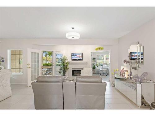 303 Patterson View Sw, Calgary, AB - Indoor Photo Showing Living Room With Fireplace