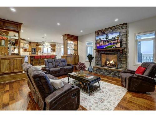 270024 N2N Estates Ridge, Rural Rocky View County, AB - Indoor Photo Showing Living Room With Fireplace