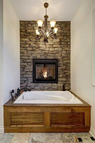 270024 N2N Estates Ridge, Rural Rocky View County, AB - Indoor Photo Showing Bathroom With Fireplace