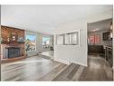 7 Templeson Road Ne, Calgary, AB  - Indoor Photo Showing Living Room With Fireplace 