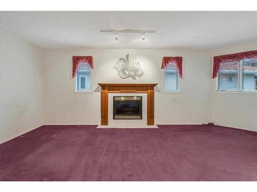 718 Centre Street, Vulcan, AB - Indoor With Fireplace