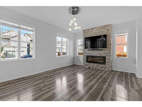 366 Windrow Crescent Sw, Airdrie, AB - Indoor Photo Showing Living Room With Fireplace