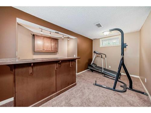 247 Lakeview Cove, Chestermere, AB - Indoor Photo Showing Gym Room