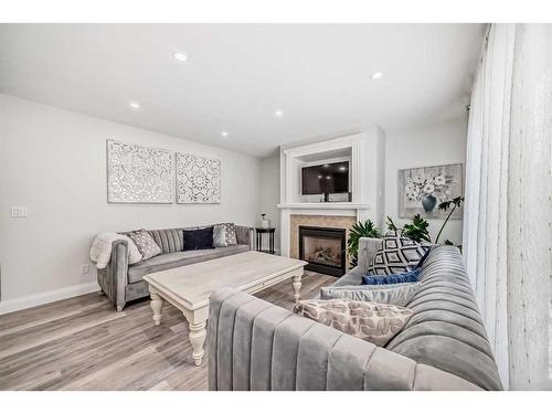 247 Lakeview Cove, Chestermere, AB - Indoor Photo Showing Living Room With Fireplace