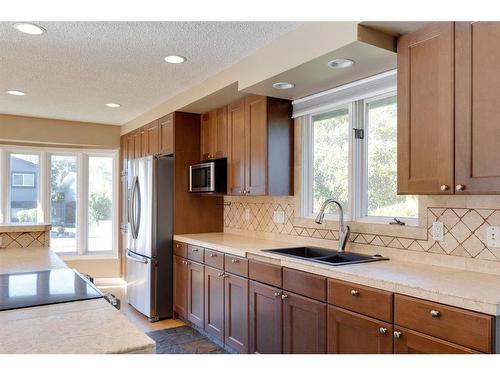 128 Deer Side Place Se, Calgary, AB - Indoor Photo Showing Kitchen With Double Sink