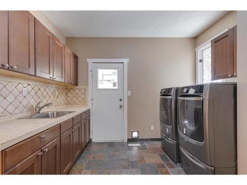 128 Deer Side Place Se, Calgary, AB - Indoor Photo Showing Laundry Room