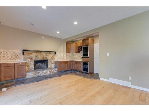 128 Deer Side Place Se, Calgary, AB - Indoor With Fireplace