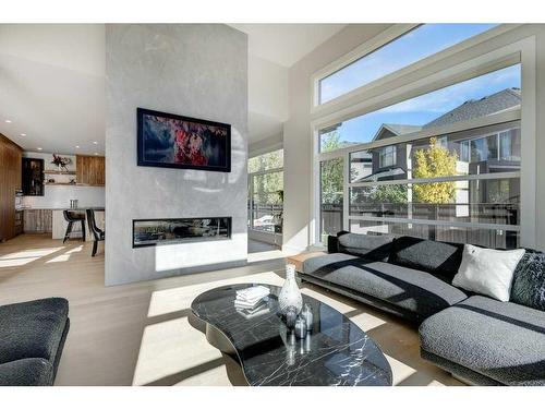 119 Aspen Summit Bay Sw, Calgary, AB - Indoor Photo Showing Living Room With Fireplace