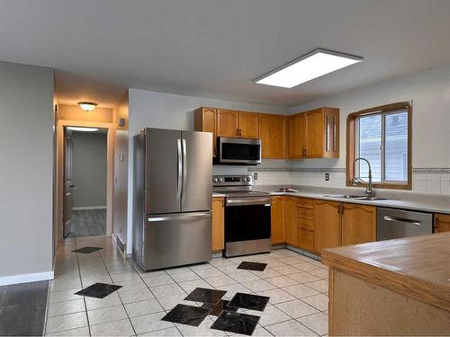 148 Mt Allan Circle Se, Calgary, AB - Indoor Photo Showing Kitchen With Double Sink