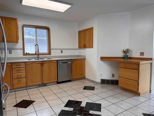 148 Mt Allan Circle Se, Calgary, AB - Indoor Photo Showing Kitchen With Double Sink