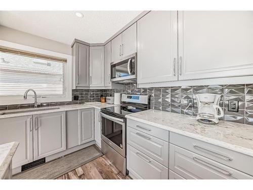 68 Citadel Pass Crescent Nw, Calgary, AB - Indoor Photo Showing Kitchen With Double Sink With Upgraded Kitchen