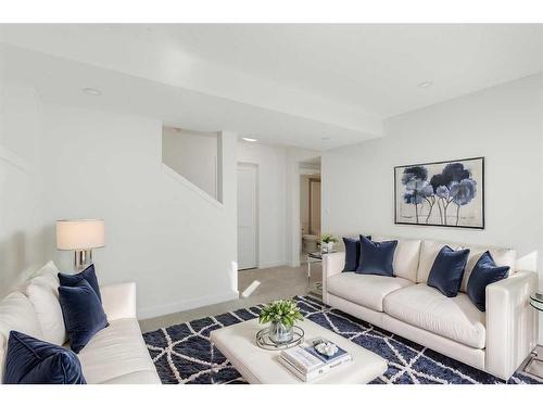 321 Baneberry Way Sw, Airdrie, AB - Indoor Photo Showing Living Room