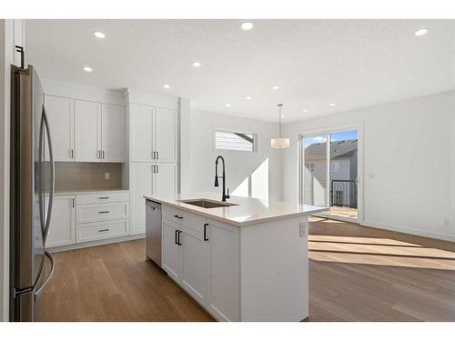 321 Baneberry Way Sw, Airdrie, AB - Indoor Photo Showing Kitchen With Upgraded Kitchen