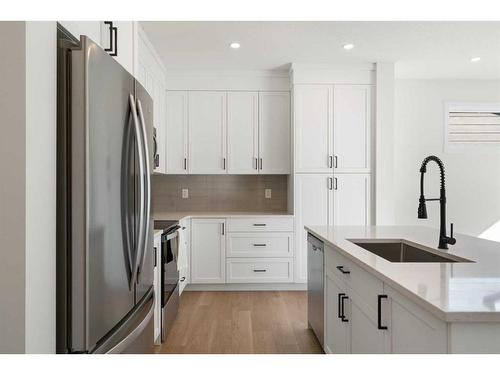 321 Baneberry Way Sw, Airdrie, AB - Indoor Photo Showing Kitchen With Upgraded Kitchen