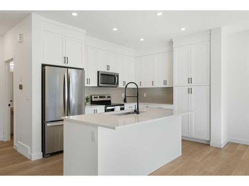 321 Baneberry Way Sw, Airdrie, AB - Indoor Photo Showing Kitchen With Upgraded Kitchen