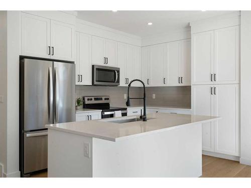 321 Baneberry Way Sw, Airdrie, AB - Indoor Photo Showing Kitchen