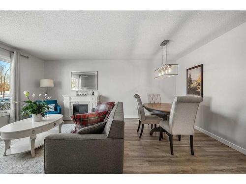 91 Midglen Way Se, Calgary, AB - Indoor With Fireplace