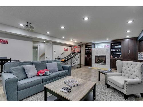 530 Tuscany Ravine Road Nw, Calgary, AB - Indoor Photo Showing Living Room With Fireplace