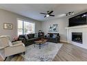 530 Tuscany Ravine Road Nw, Calgary, AB  - Indoor Photo Showing Living Room With Fireplace 