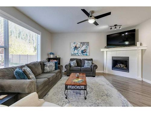 530 Tuscany Ravine Road Nw, Calgary, AB - Indoor Photo Showing Living Room With Fireplace