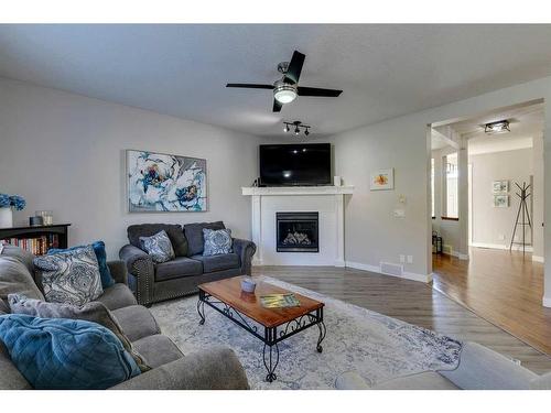 530 Tuscany Ravine Road Nw, Calgary, AB - Indoor Photo Showing Living Room With Fireplace