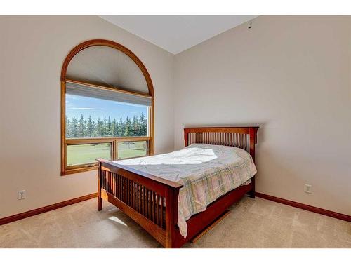 15 Taylor Bay, Rural Rocky View County, AB - Indoor Photo Showing Bedroom