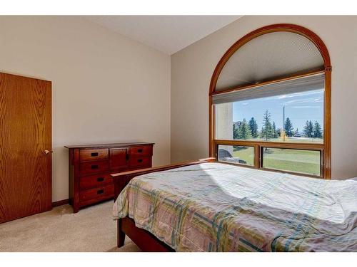 15 Taylor Bay, Rural Rocky View County, AB - Indoor Photo Showing Bedroom