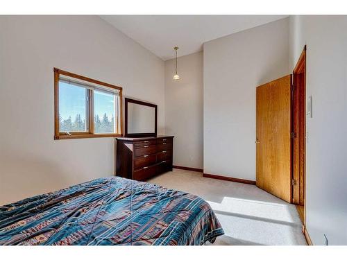 15 Taylor Bay, Rural Rocky View County, AB - Indoor Photo Showing Bedroom