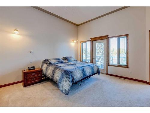 15 Taylor Bay, Rural Rocky View County, AB - Indoor Photo Showing Bedroom