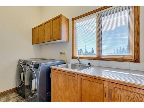 15 Taylor Bay, Rural Rocky View County, AB - Indoor Photo Showing Laundry Room