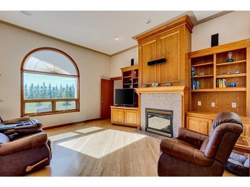 15 Taylor Bay, Rural Rocky View County, AB - Indoor Photo Showing Living Room With Fireplace