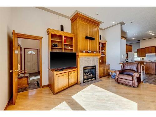 15 Taylor Bay, Rural Rocky View County, AB - Indoor Photo Showing Living Room With Fireplace