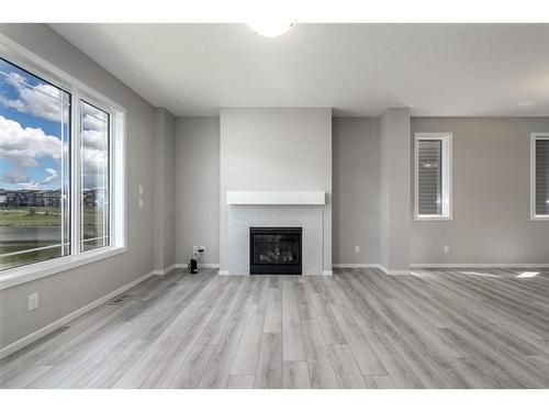 181 Carrington Crescent Nw, Calgary, AB - Indoor Photo Showing Living Room With Fireplace