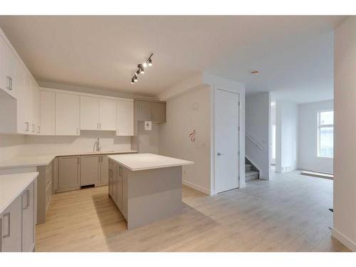 2-4532 17 Avenue Nw, Calgary, AB - Indoor Photo Showing Kitchen With Double Sink