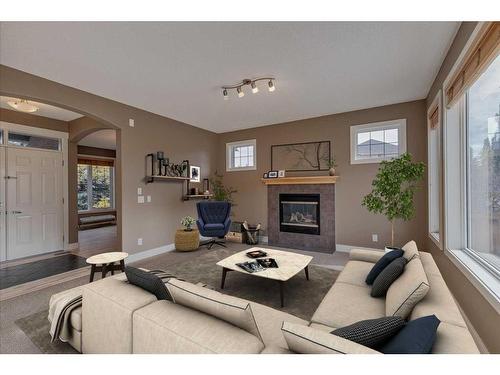 3 Evergreen Square Sw, Calgary, AB - Indoor Photo Showing Living Room With Fireplace