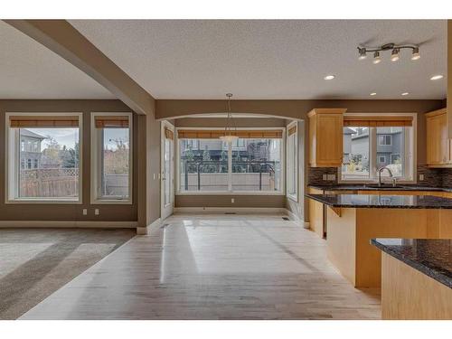 3 Evergreen Square Sw, Calgary, AB - Indoor Photo Showing Kitchen With Double Sink