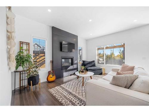 277 Willow Park, Cochrane, AB - Indoor Photo Showing Living Room With Fireplace