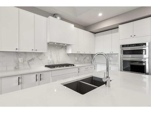 230 Marmot Walk Nw, Calgary, AB - Indoor Photo Showing Kitchen With Double Sink With Upgraded Kitchen